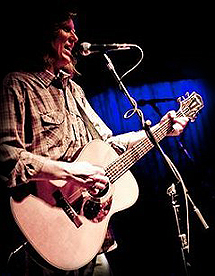 Photo of Tim Jackson playing live at the Saxon Pub in New Orleans.
